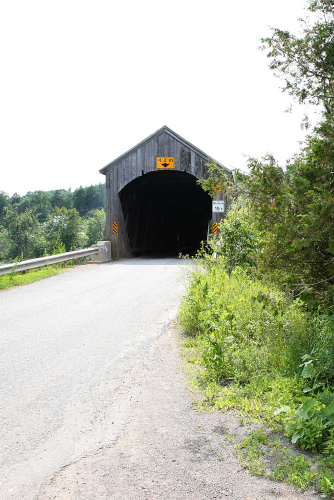 Old covered bridge in New Brunswick Canada is part of the rich heritage and historical charm of Atlantic Canada