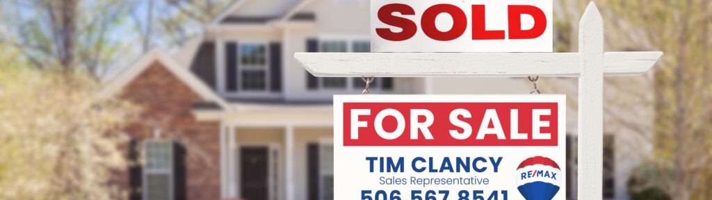 Spring home in New Brunswick with for sale sign – best time to sell a house in NB